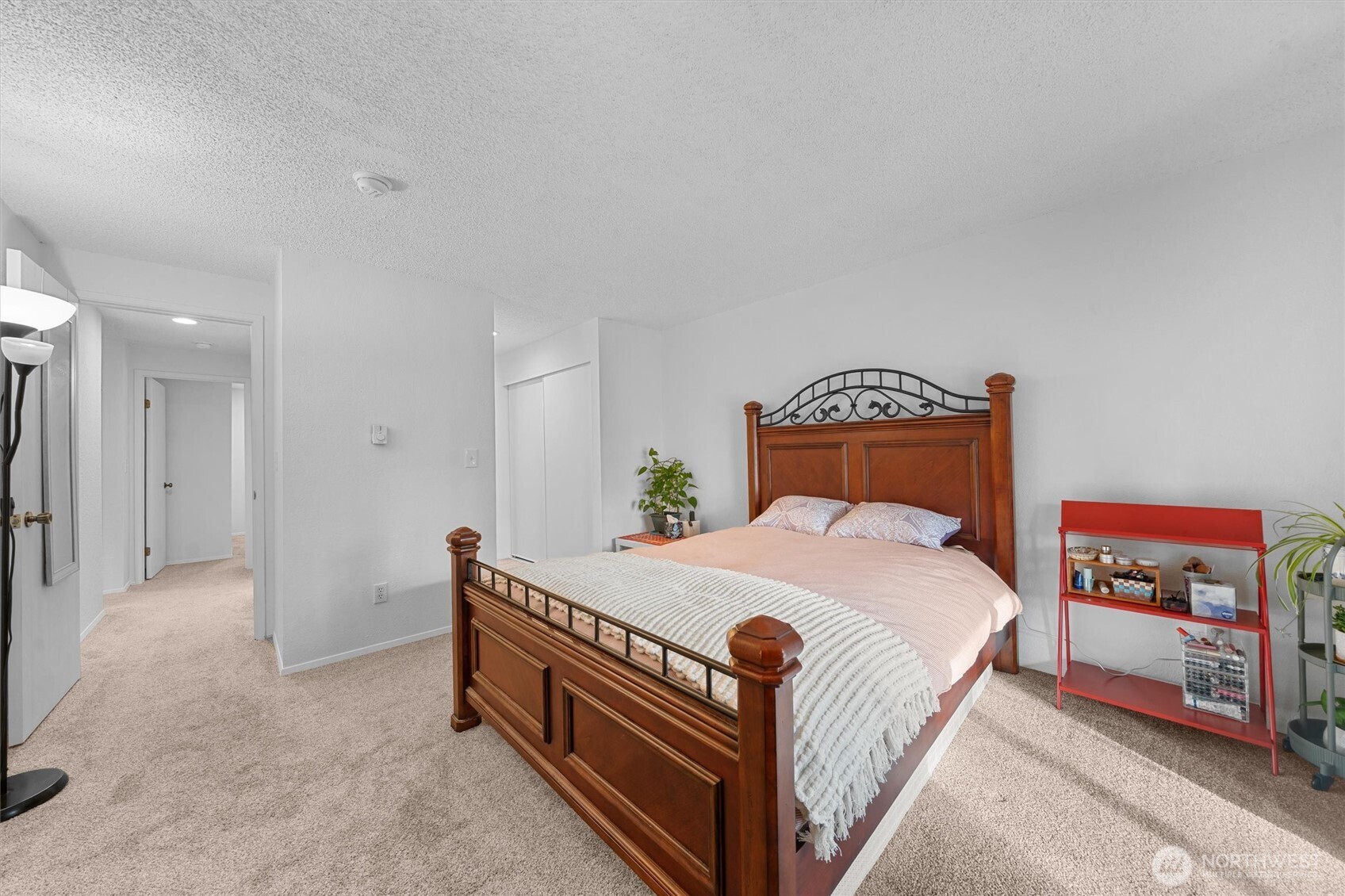 2515 Northeast 4th Street, Unit 522 Renton, WA 98056 - Photo 13 of 33 a bedroom with a bed and a book shelf