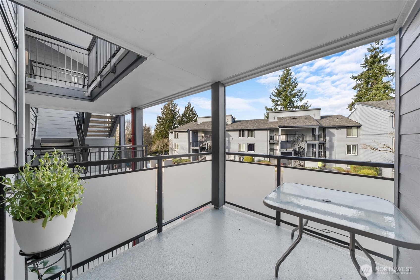2515 Northeast 4th Street, Unit 522 Renton, WA 98056 - Photo 20 of 33 a view of a porch with furniture and a window