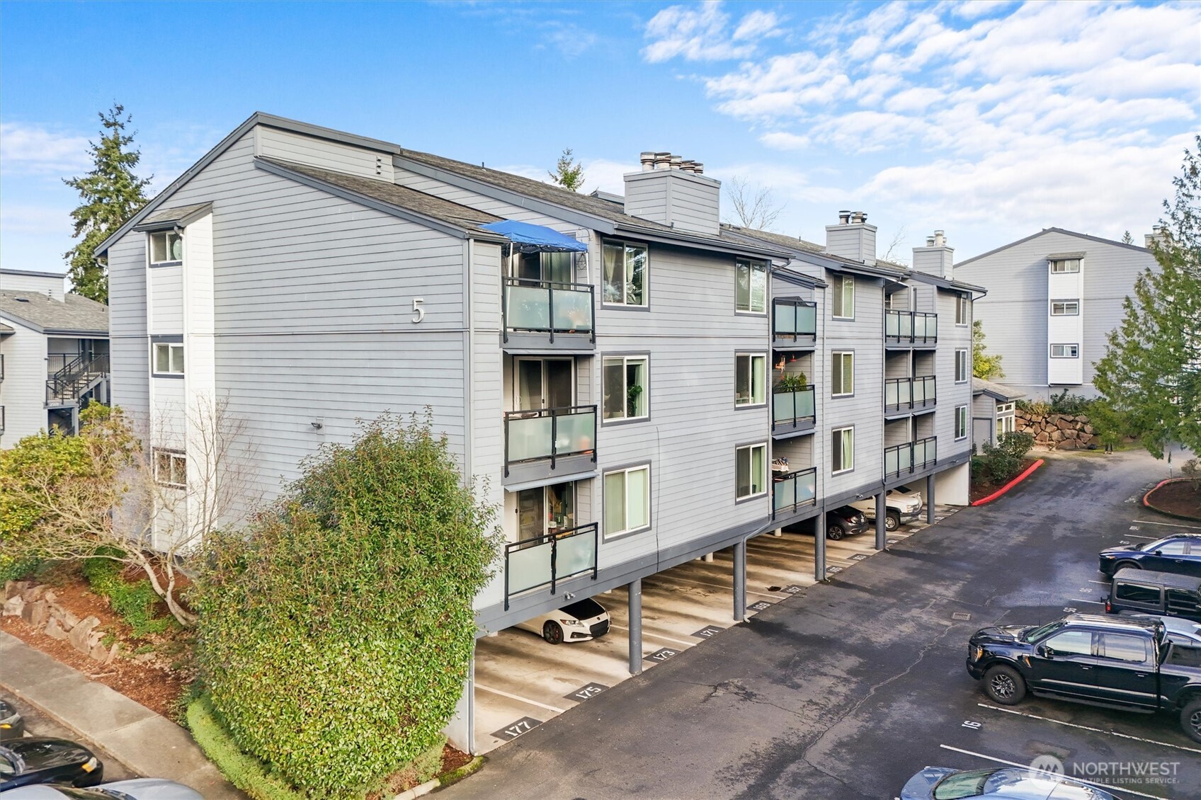 2515 Northeast 4th Street, Unit 522 Renton, WA 98056 - Photo 26 of 33 a view of residential houses with yard and trees