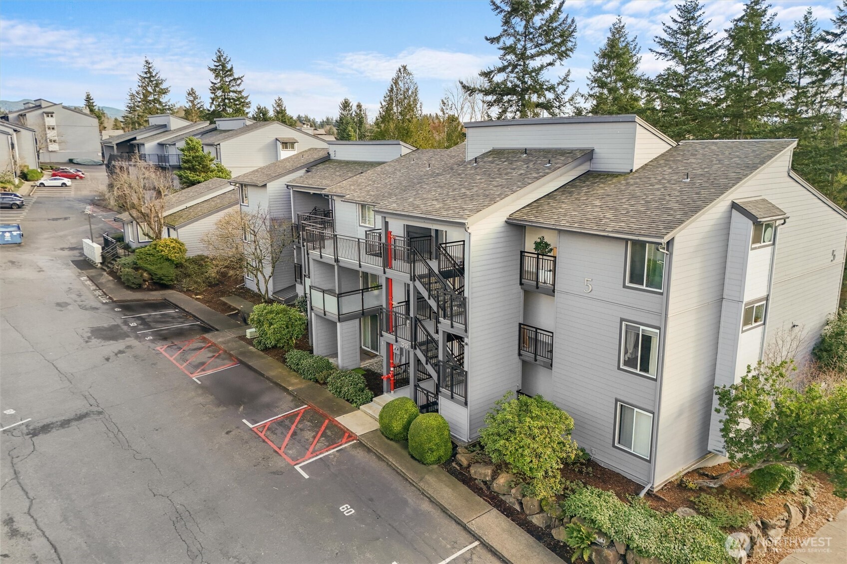 2515 Northeast 4th Street, Unit 522 Renton, WA 98056 - Photo 27 of 33 a aerial view of a house with a yard and potted plants