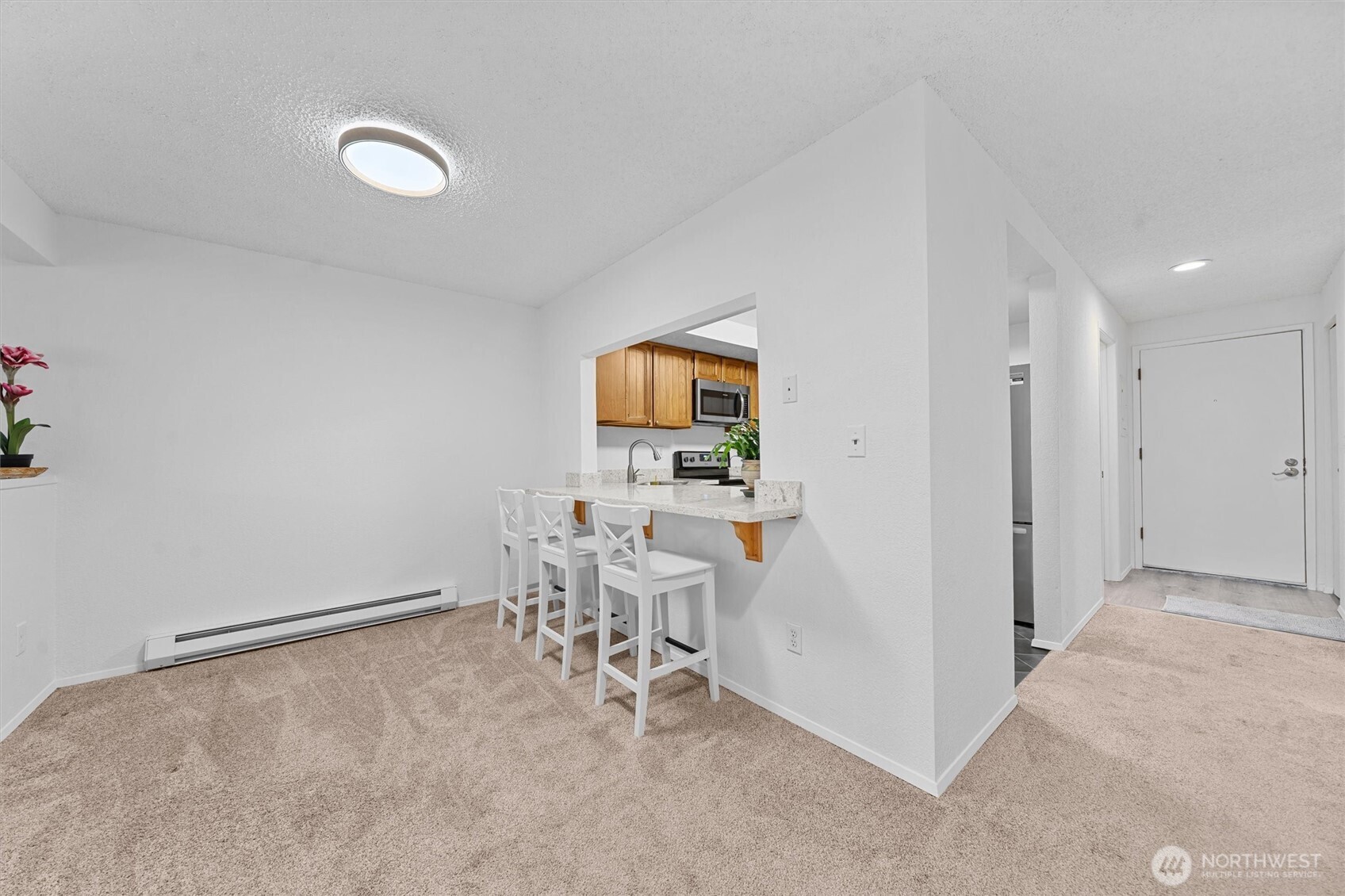 2515 Northeast 4th Street, Unit 522 Renton, WA 98056 - Photo 9 of 33 a view of room with furniture and wooden floor