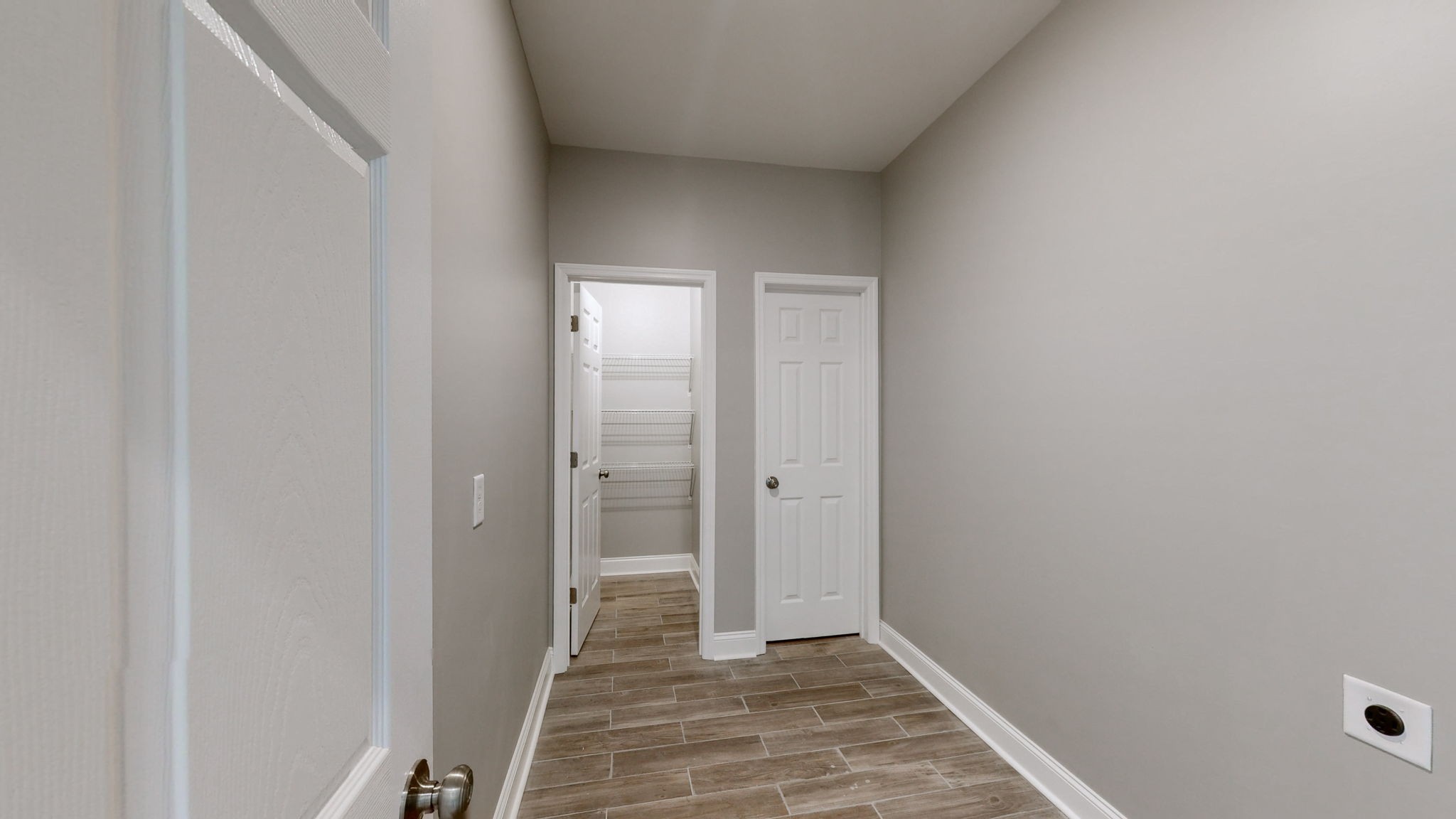 1093 Bob Meadows Road Manchester, TN 37355 - Photo 12 of 43 a view of hallway with an empty room and wooden floor