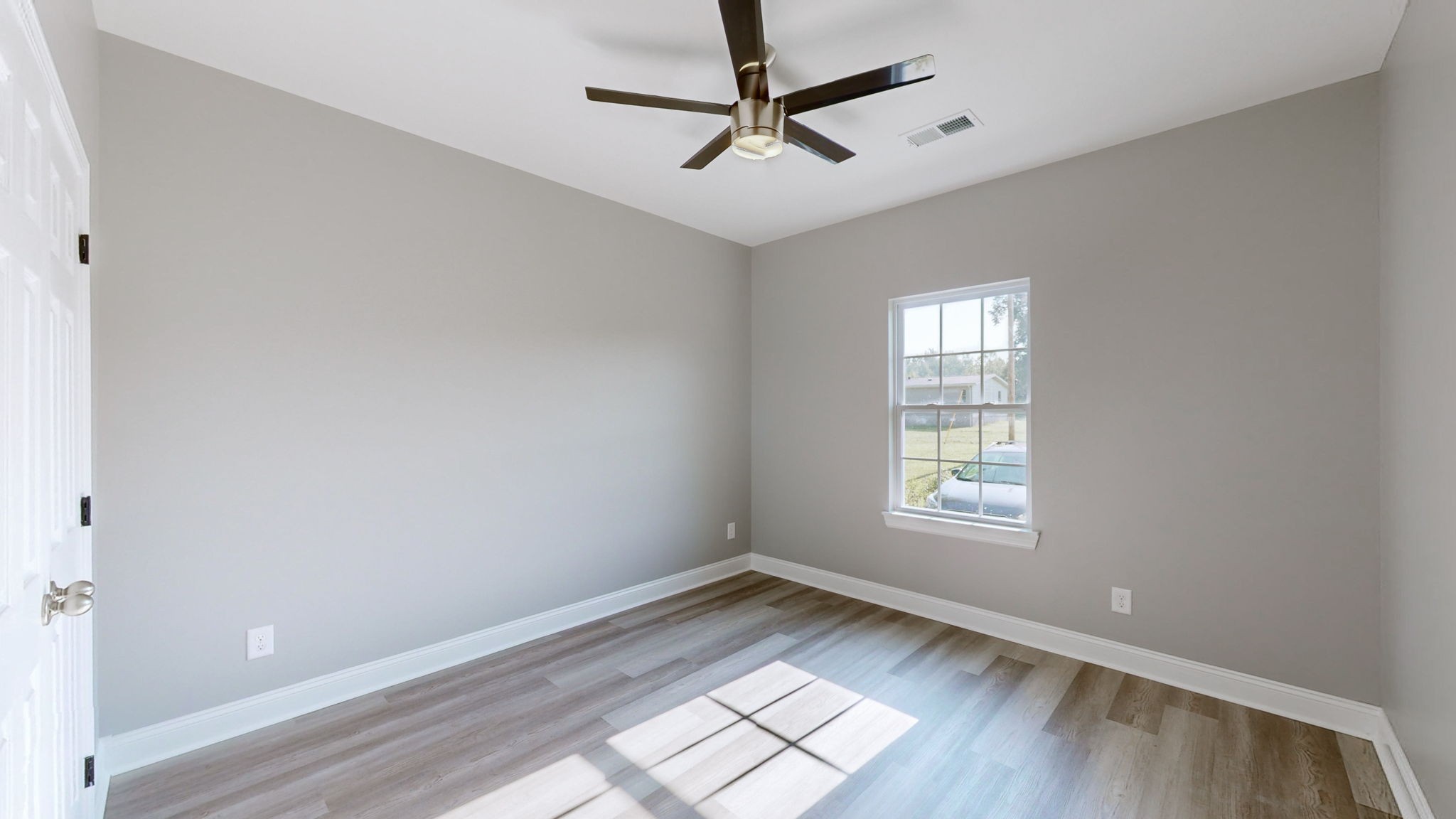1093 Bob Meadows Road Manchester, TN 37355 - Photo 17 of 43 a view of empty room with wooden floor and fan