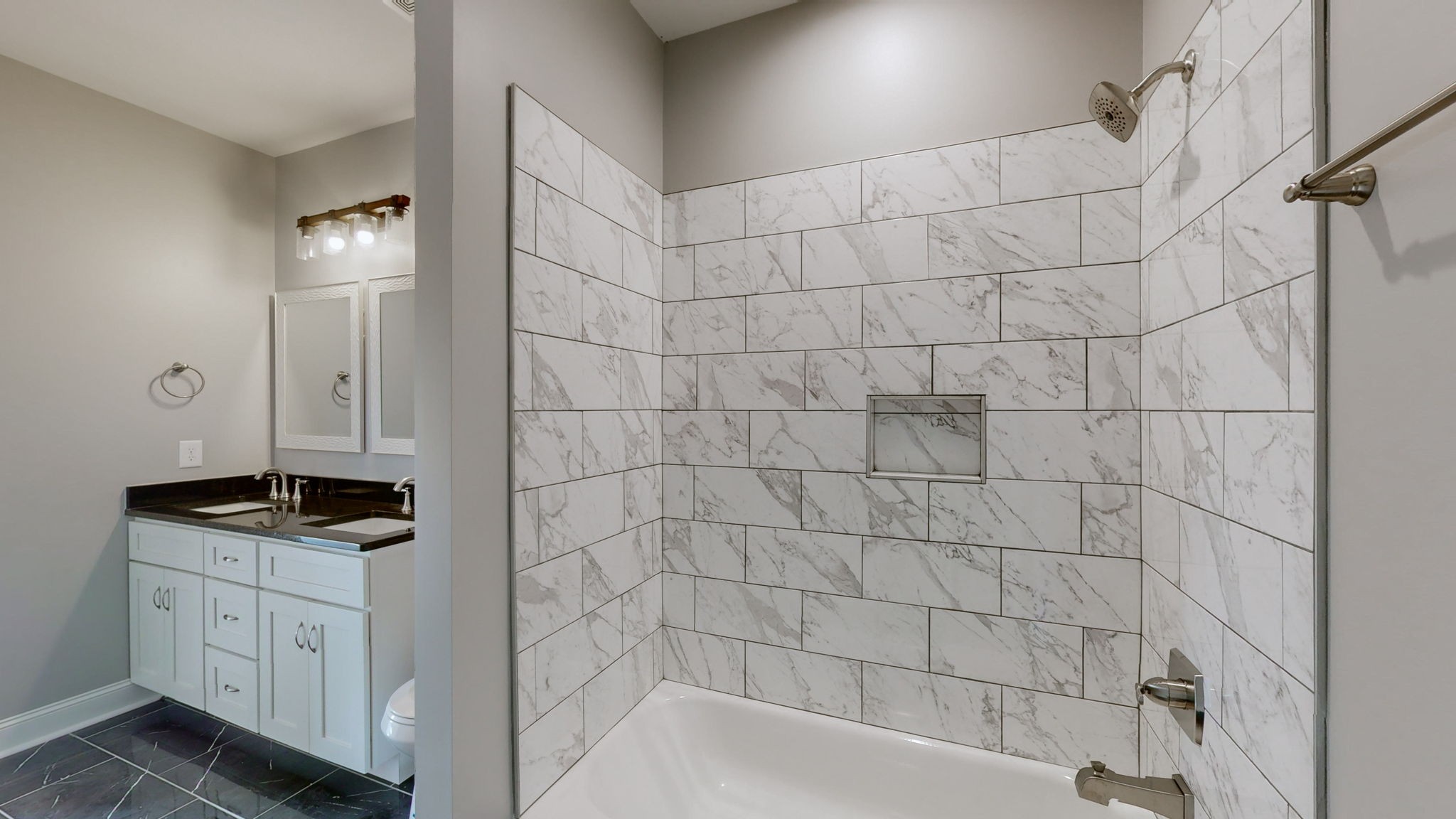 1093 Bob Meadows Road Manchester, TN 37355 - Photo 24 of 43 a bathroom with a granite countertop sink a toilet and bathtub