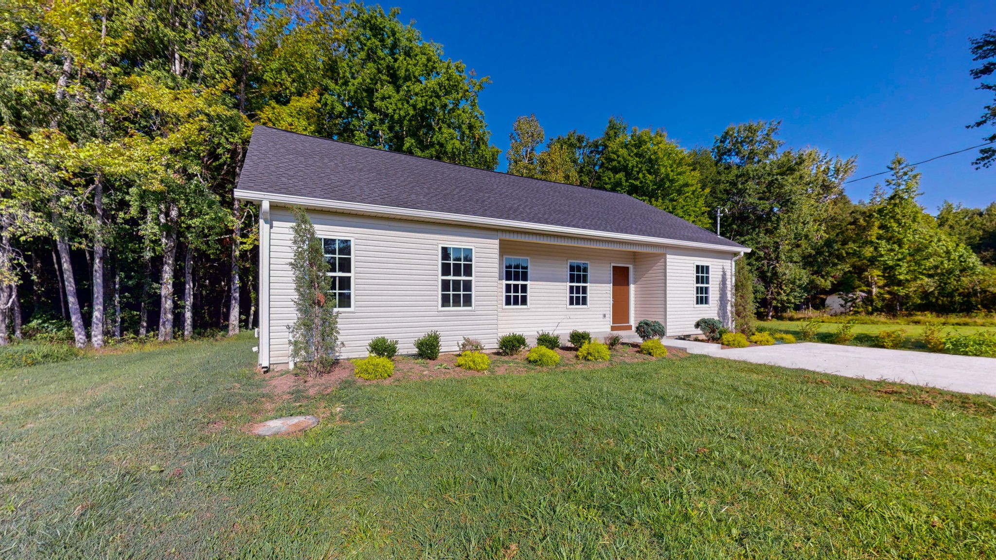 1093 Bob Meadows Road Manchester, TN 37355 - Photo 26 of 43 a front view of a house with a yard