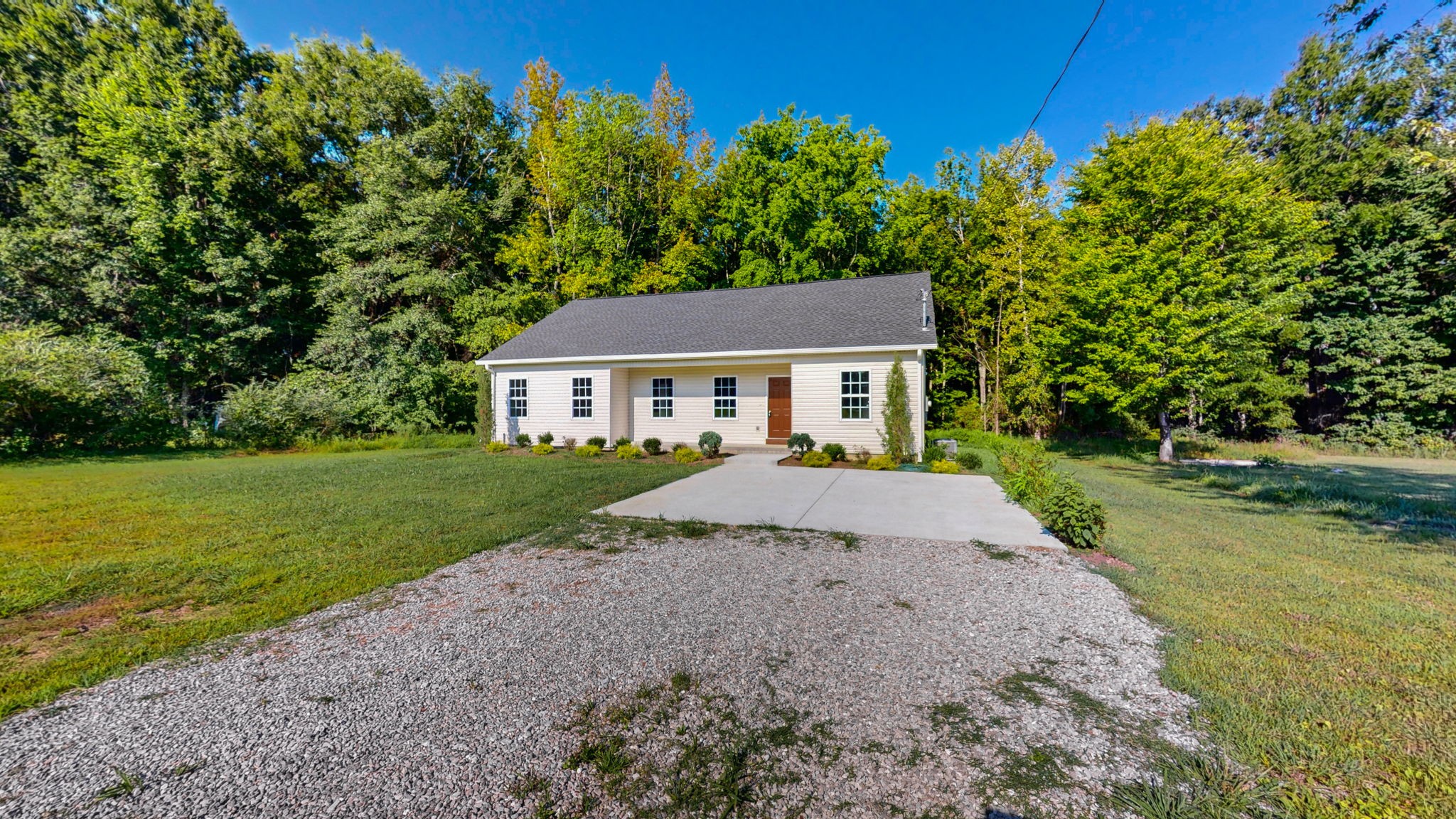 1093 Bob Meadows Road Manchester, TN 37355 - Photo 28 of 43 a house with huge green field in front of it