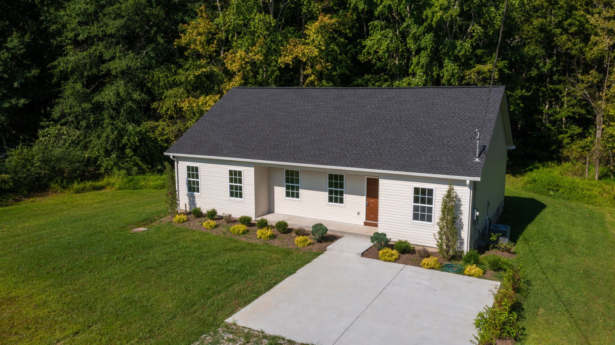 1093 Bob Meadows Road Manchester, TN 37355 - Photo 33 of 43 front view of a house with a yard