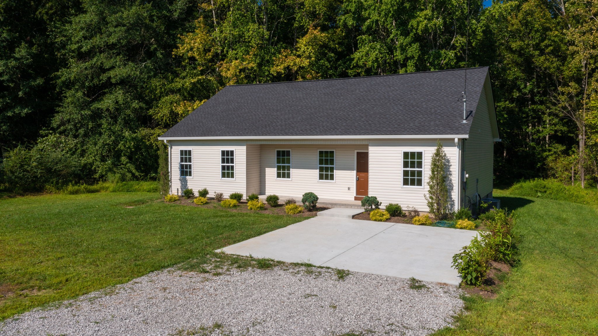 1093 Bob Meadows Road Manchester, TN 37355 - Photo 34 of 43 front view of a house with a yard