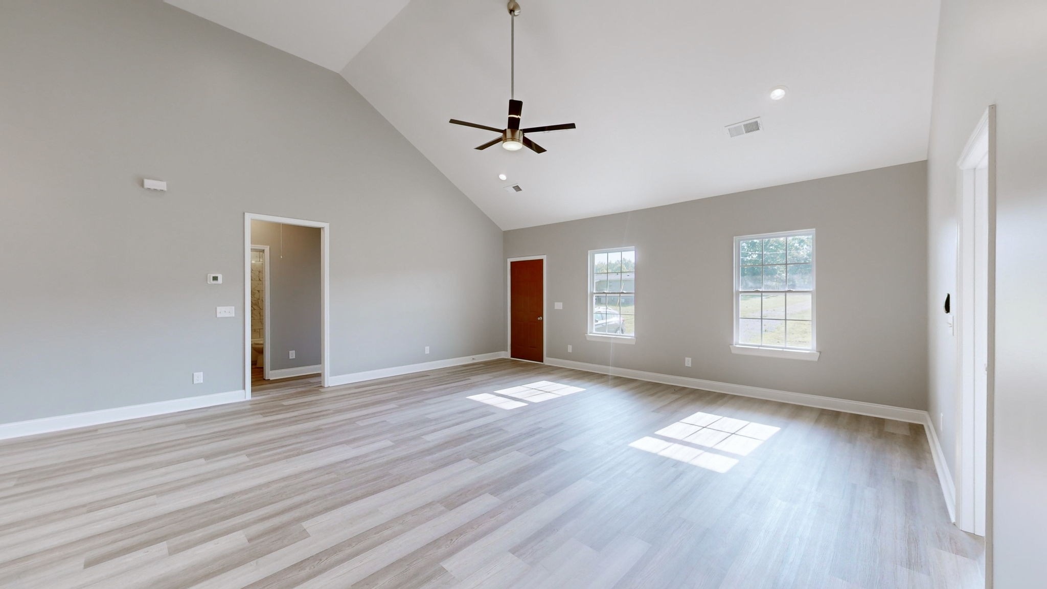 1093 Bob Meadows Road Manchester, TN 37355 - Photo 6 of 43 a view of empty room with wooden floor and fan
