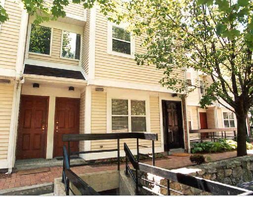 57 Highland Road, Unit 57 Stamford, CT 06901 - Photo 1 of 1 a view of a house with a backyard