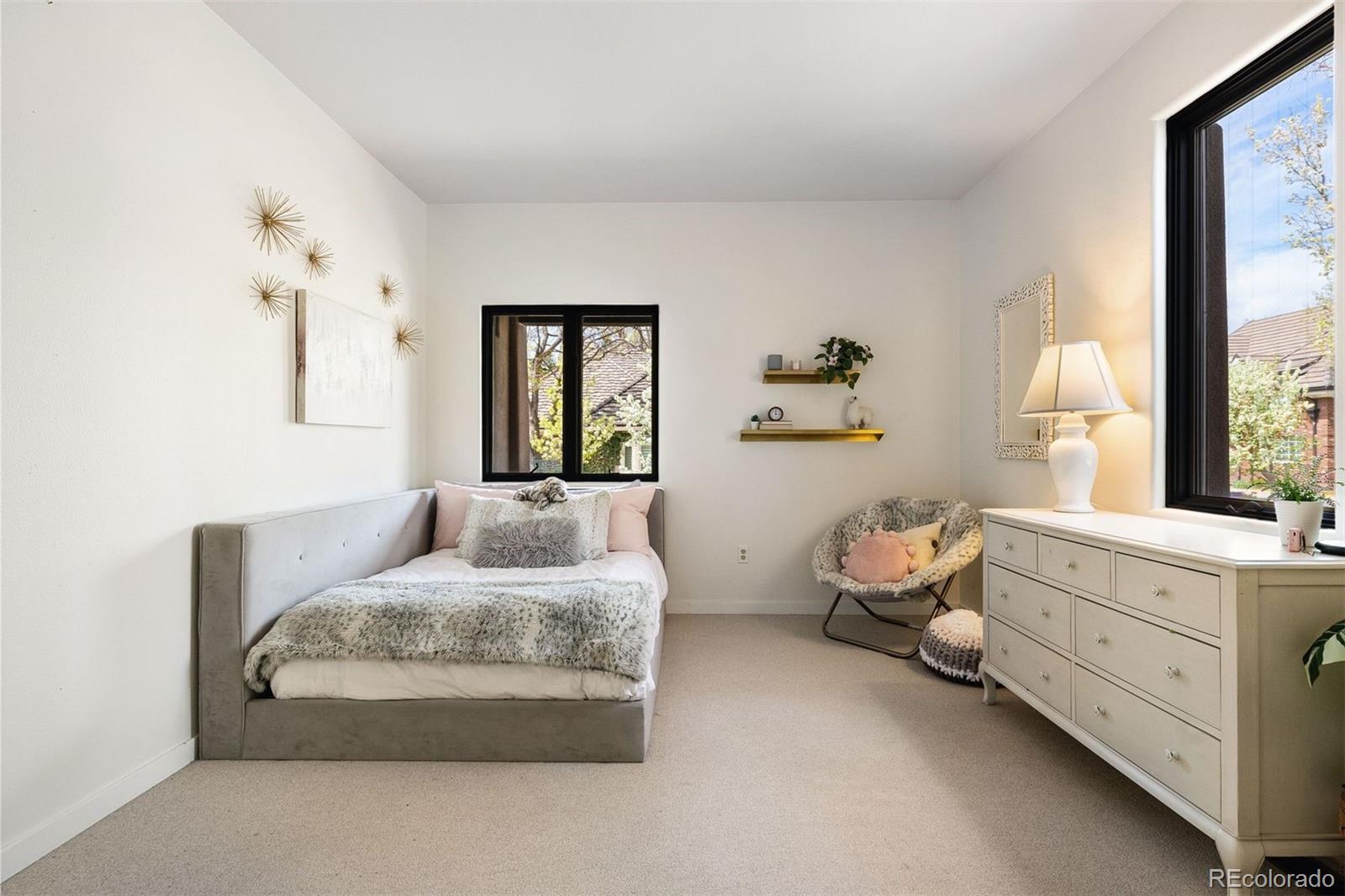 9 Polo Field Lane Denver, CO 80209 - Photo 14 of 36 a bedroom with bed and window