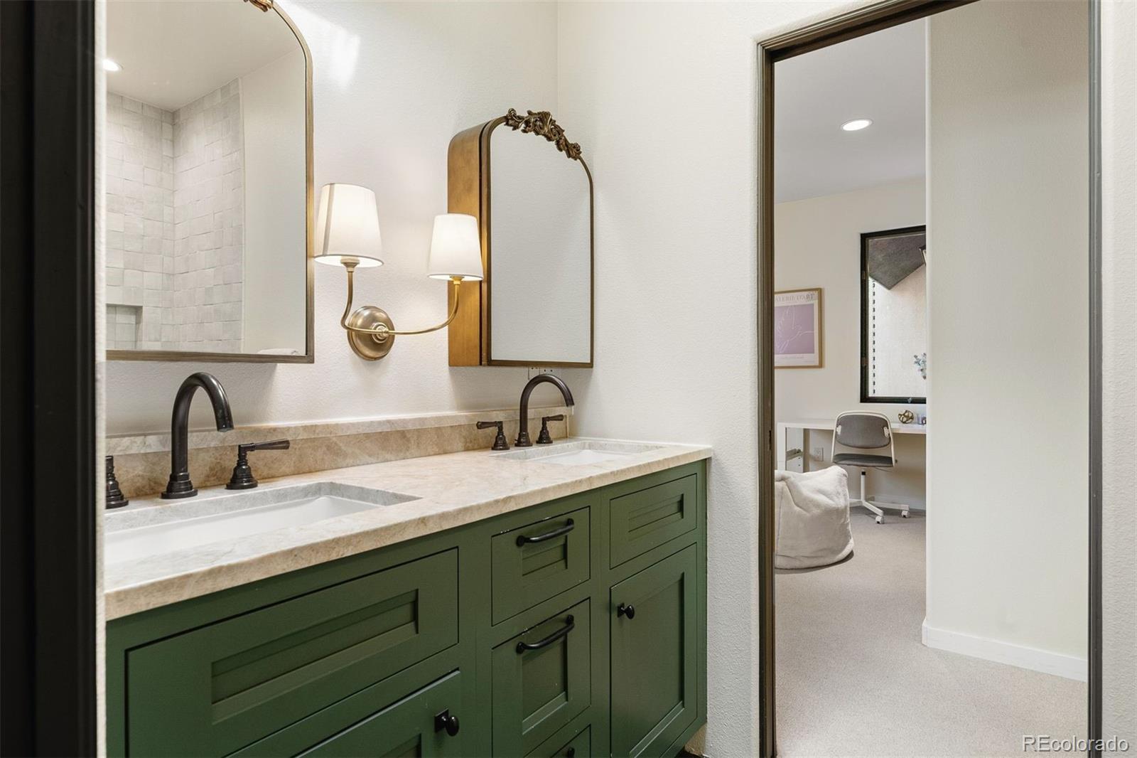 9 Polo Field Lane Denver, CO 80209 - Photo 15 of 36 a bathroom with a double vanity sink and a mirror