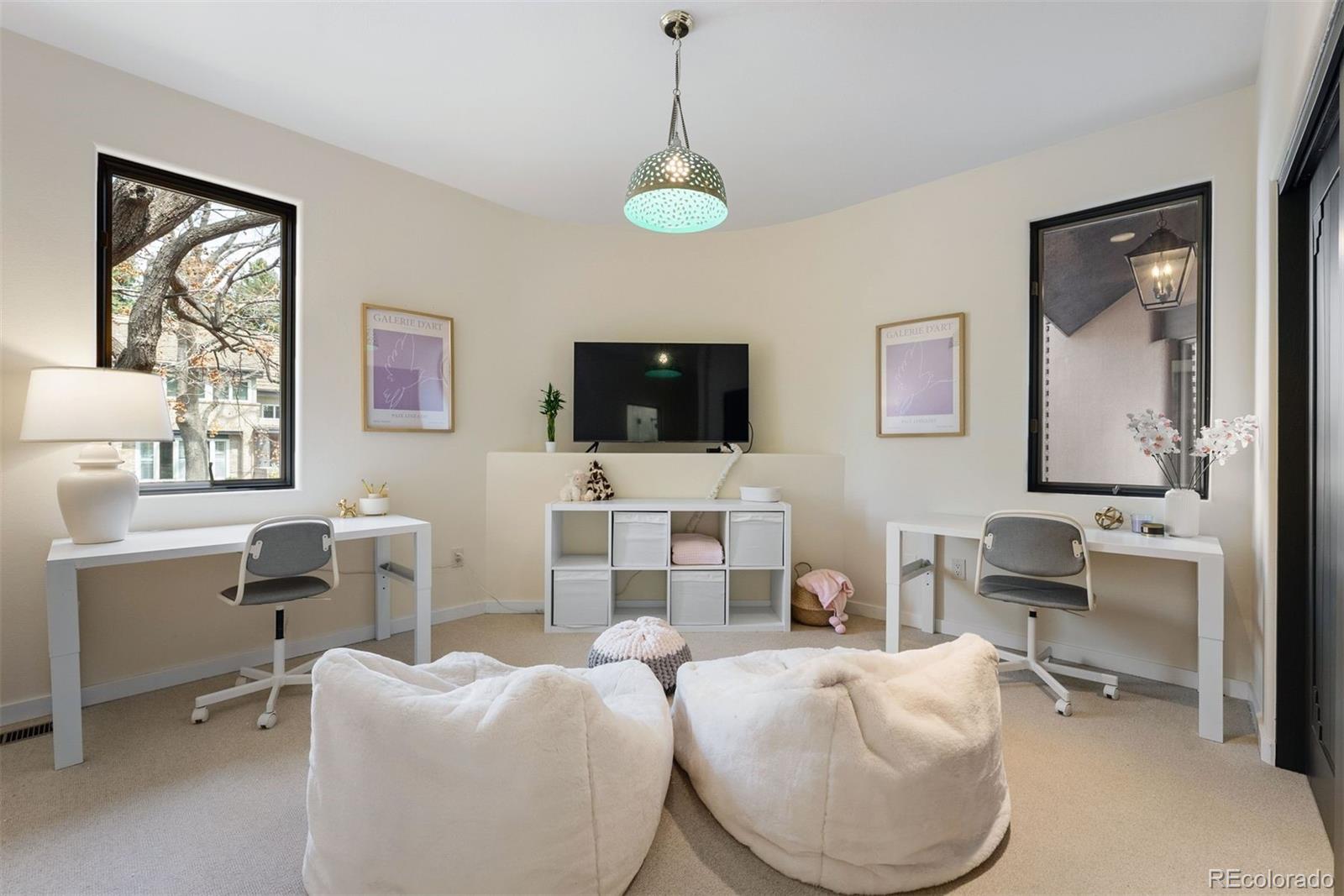 9 Polo Field Lane Denver, CO 80209 - Photo 16 of 36 a living room with furniture a flat screen tv and window