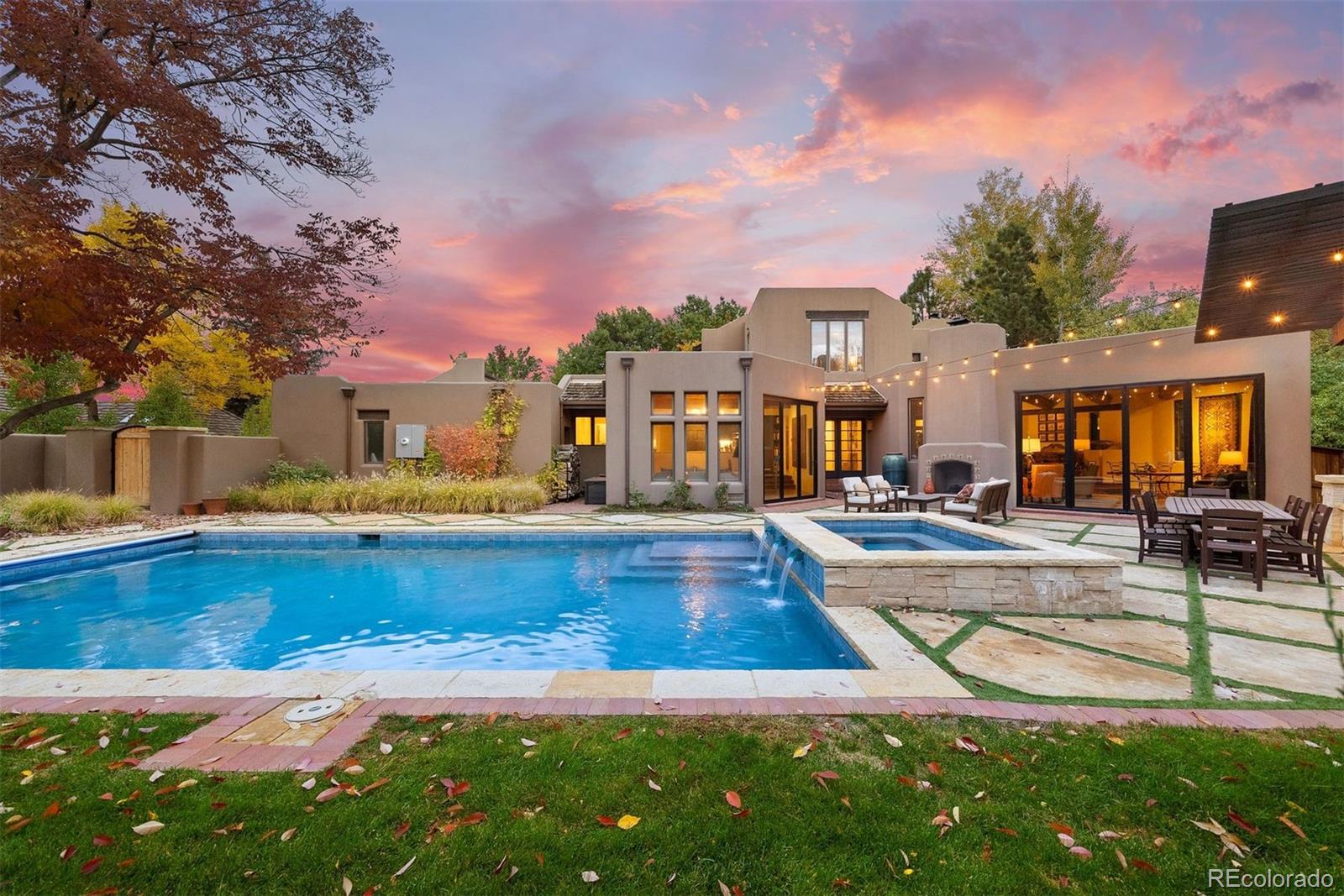 9 Polo Field Lane Denver, CO 80209 - Photo 2 of 36 a view of a swimming pool with a lounge chairs