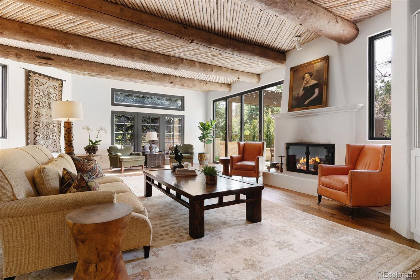 9 Polo Field Lane Denver, CO 80209 - Photo 4 of 36 a living room with furniture and a fireplace