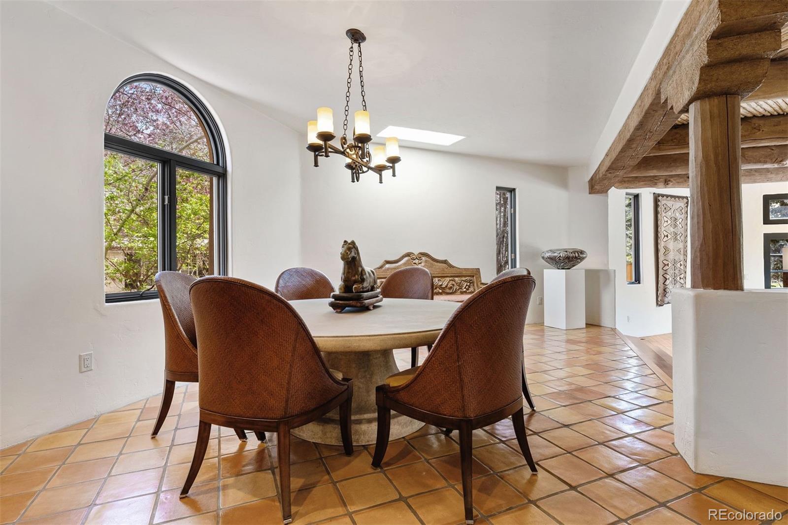 9 Polo Field Lane Denver, CO 80209 - Photo 5 of 36 a view of a dining room with furniture window and outside view