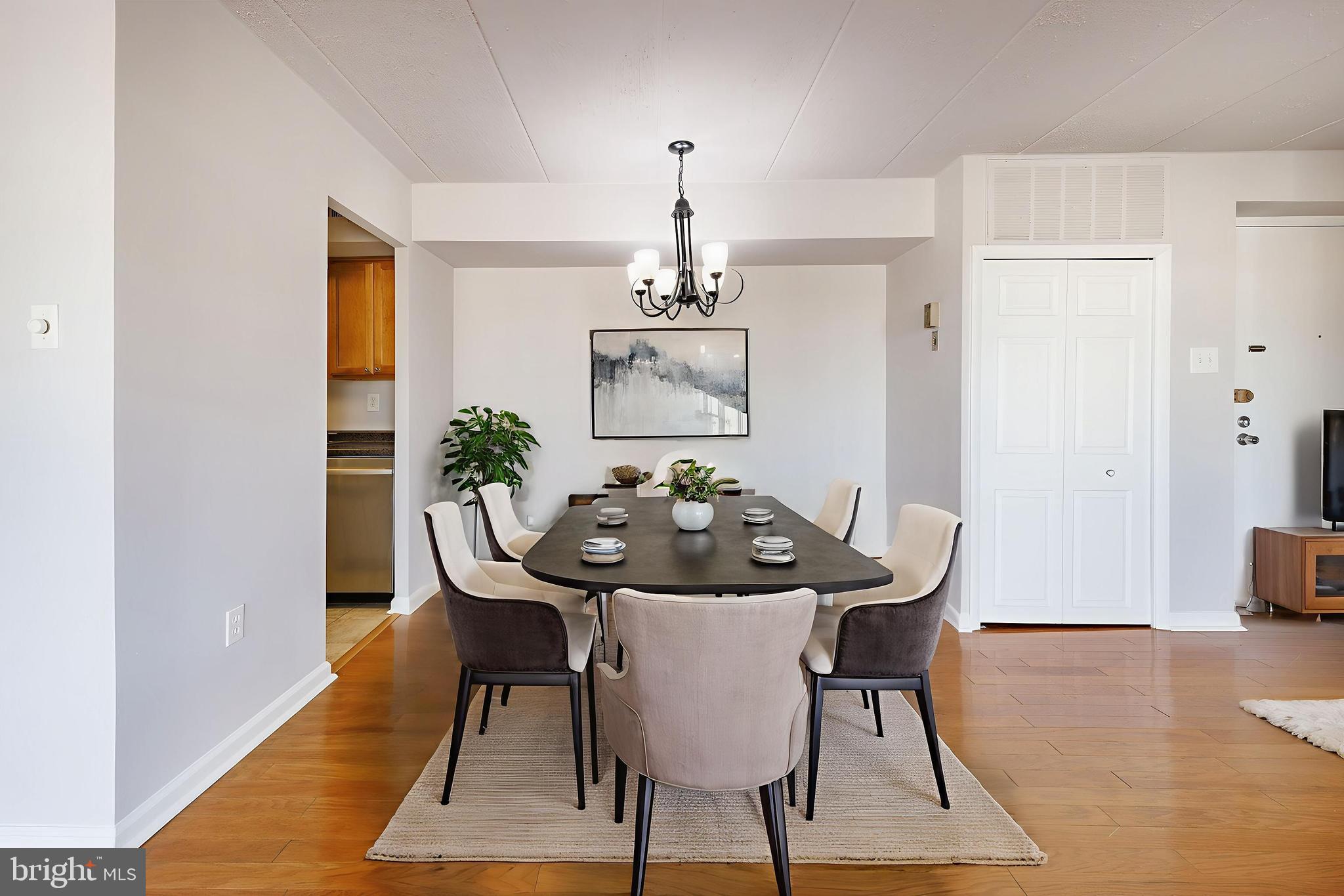 a view of a dining room with furniture and wooden floor
