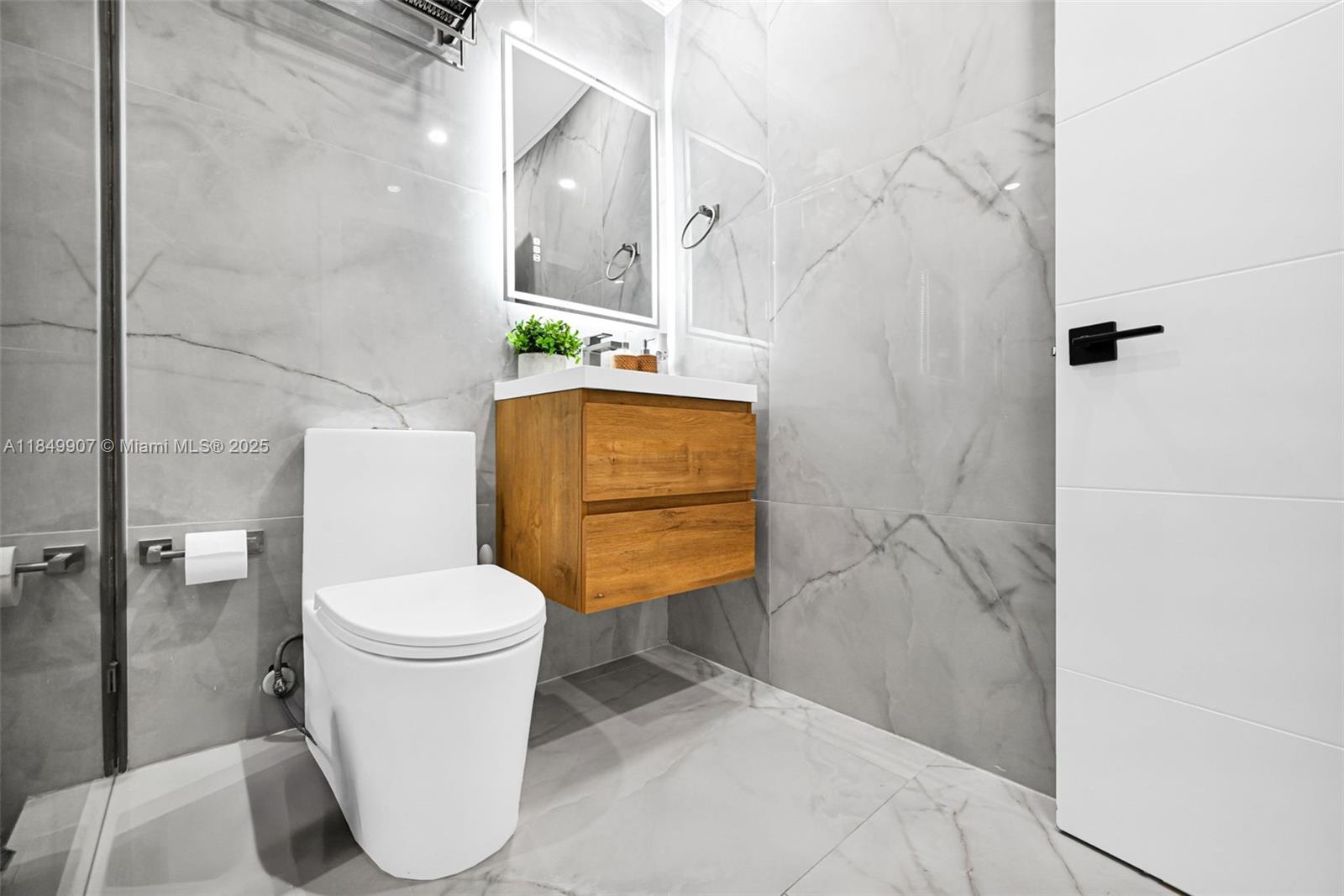 19777 Southwest 334th Street Homestead, FL 33034 - Photo 32 of 55 a bathroom with a toilet and a shower