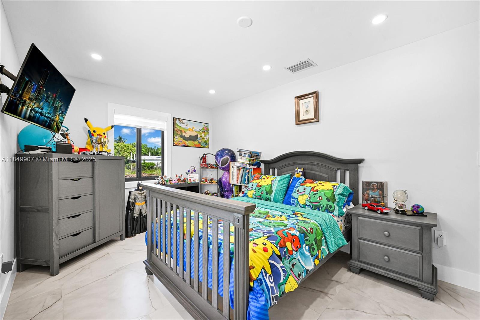 19777 Southwest 334th Street Homestead, FL 33034 - Photo 36 of 55 a bedroom with furniture a baby crib and a dresser