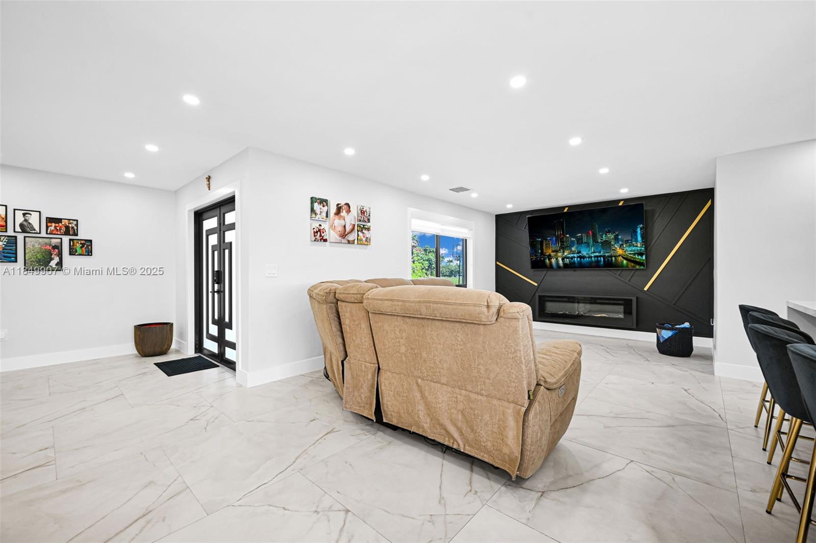 19777 Southwest 334th Street Homestead, FL 33034 - Photo 6 of 55 a living room with furniture and a flat screen tv