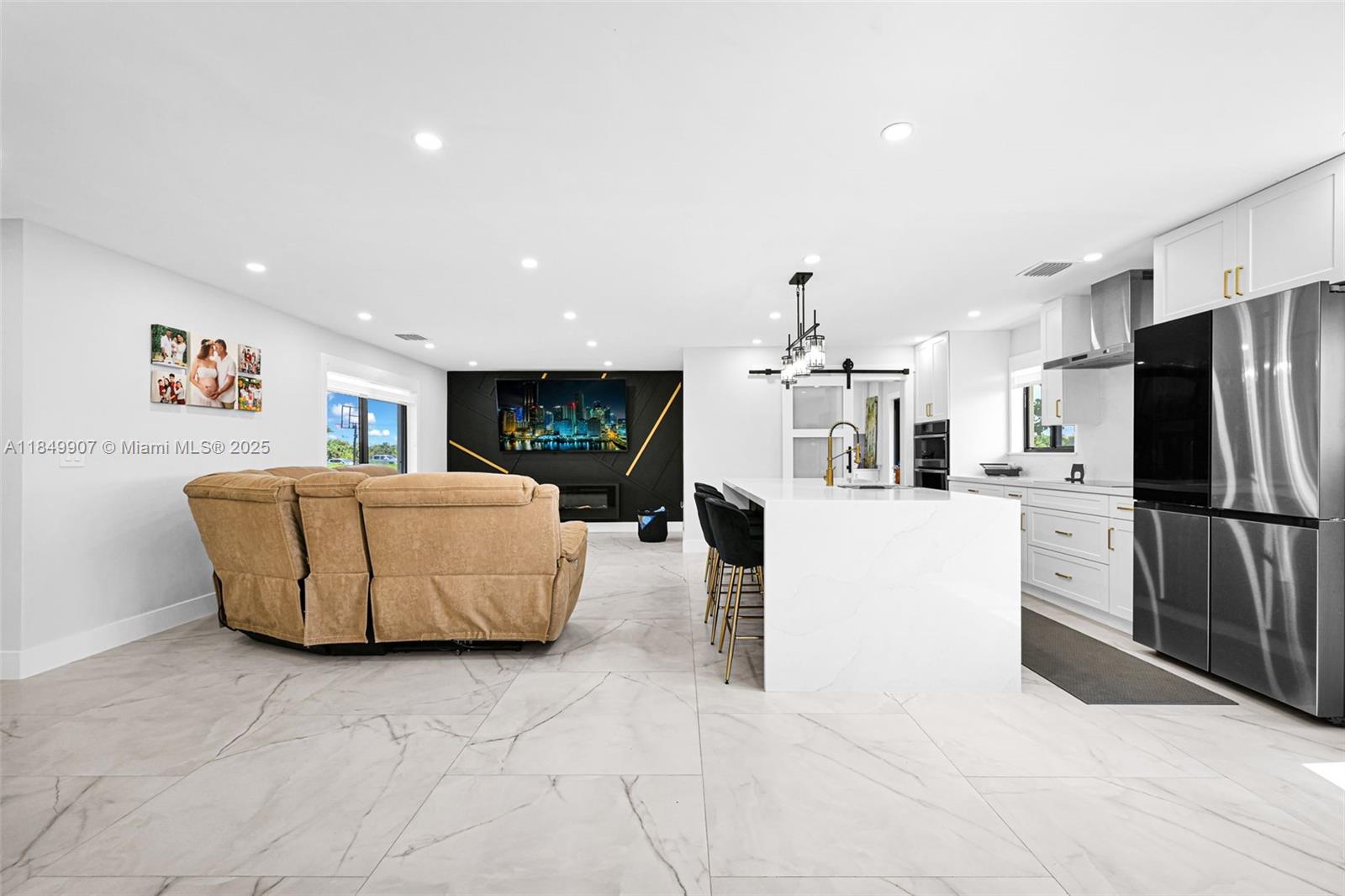 19777 Southwest 334th Street Homestead, FL 33034 - Photo 10 of 55 a living room with furniture and a flat screen tv
