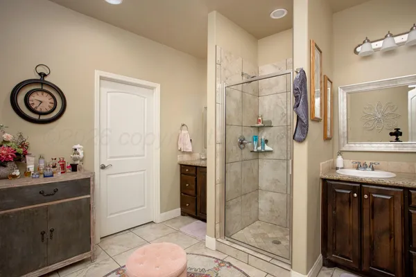 a view of bathroom with a sink and a mirror