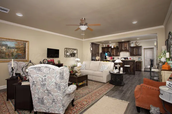 a living room with furniture and a flat screen tv