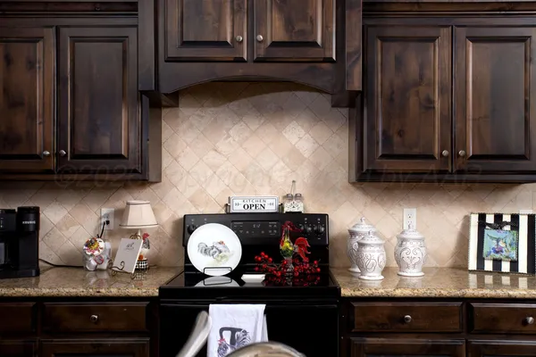 a kitchen with a stove and cabinets