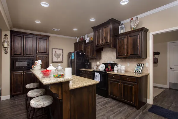 a kitchen with granite countertop lots of counter top space