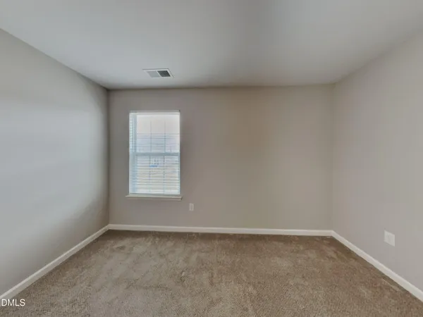 a view of a window in an empty room