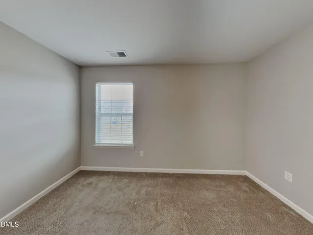 a view of a window in an empty room