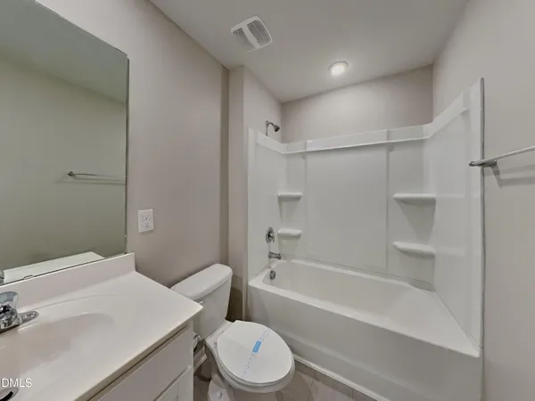a bathroom with a sink a toilet and a bathtub