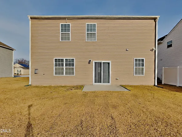 a view of an empty room with basketball court