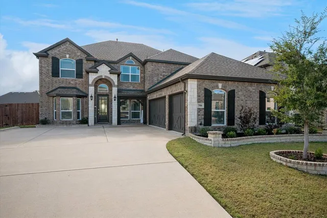 a view of a house with tub and couches in the patio