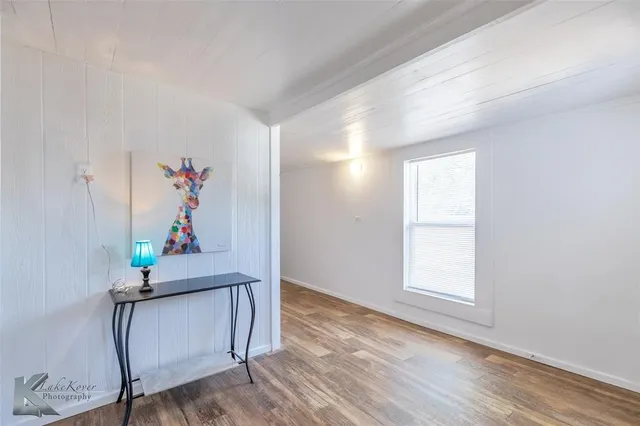 a view of an entryway with wooden floor
