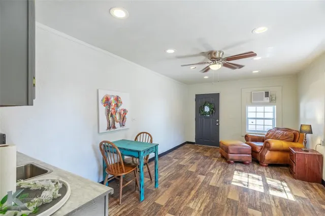 a bedroom with furniture and a chandelier