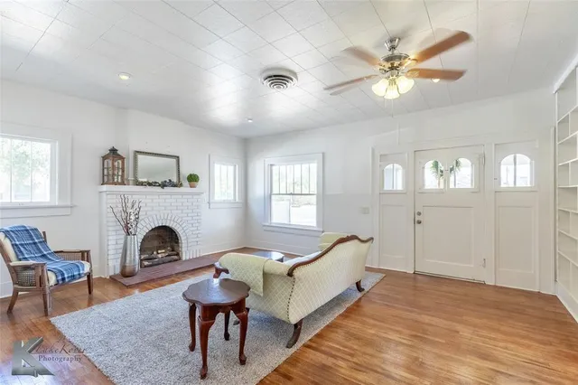 a living room with furniture and a fireplace