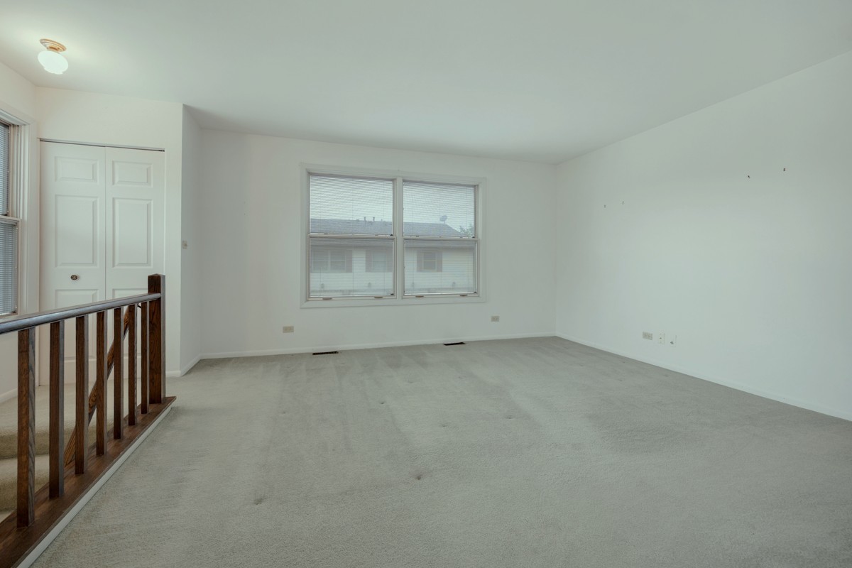 784 Leicester Road Elk Grove Village, IL 60007 - Photo 4 of 27 a view of an empty room with a window