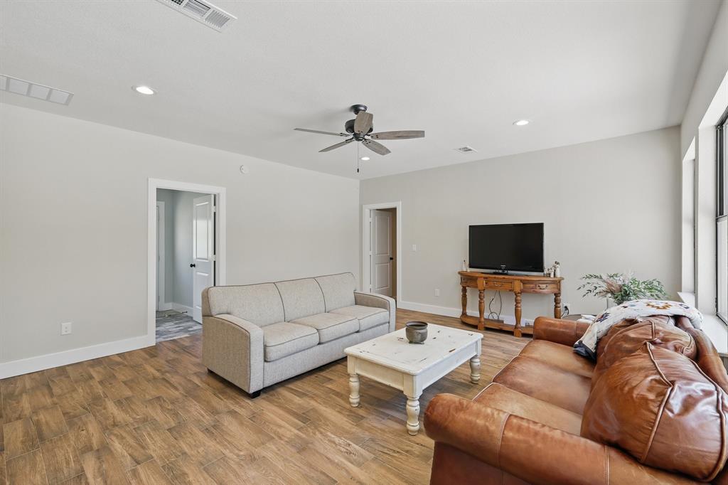 2446 Neely Trail Valley View, TX 76272 - Photo 13 of 29 a living room with furniture and a flat screen tv