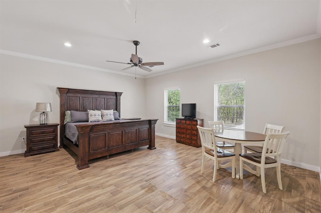 2446 Neely Trail Valley View, TX 76272 - Photo 14 of 29 a bedroom with furniture and wooden floor