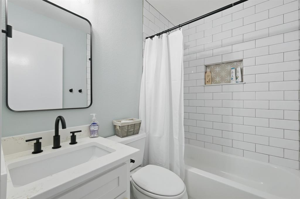 2446 Neely Trail Valley View, TX 76272 - Photo 22 of 29 a bathroom with a sink toilet and shower