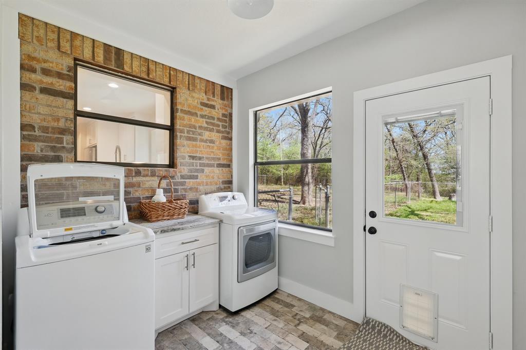 2446 Neely Trail Valley View, TX 76272 - Photo 25 of 29 a kitchen with a sink cabinets and window