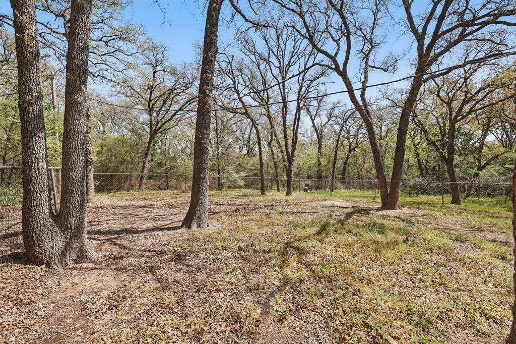 2446 Neely Trail Valley View, TX 76272 - Photo 26 of 29 a view of outdoor space with trees