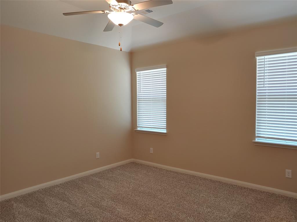 280 Moonstone Way Princeton, TX 75407 - Photo 13 of 17 Carpeted spare room with a healthy amount of sunlight and ceiling fan