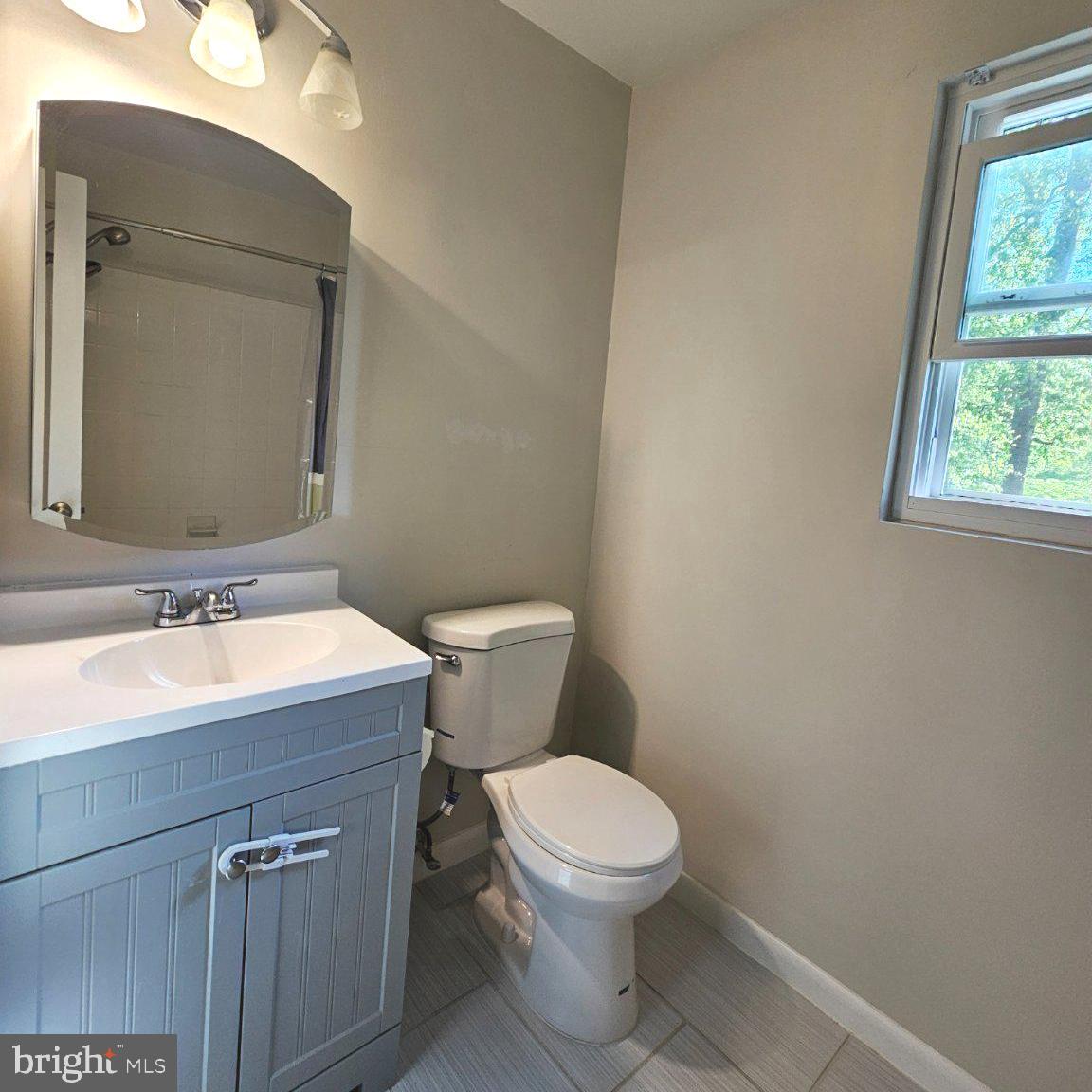 7433 Grace Street Springfield, VA 22150 - Photo 14 of 24 Modern bathroom with natural light.