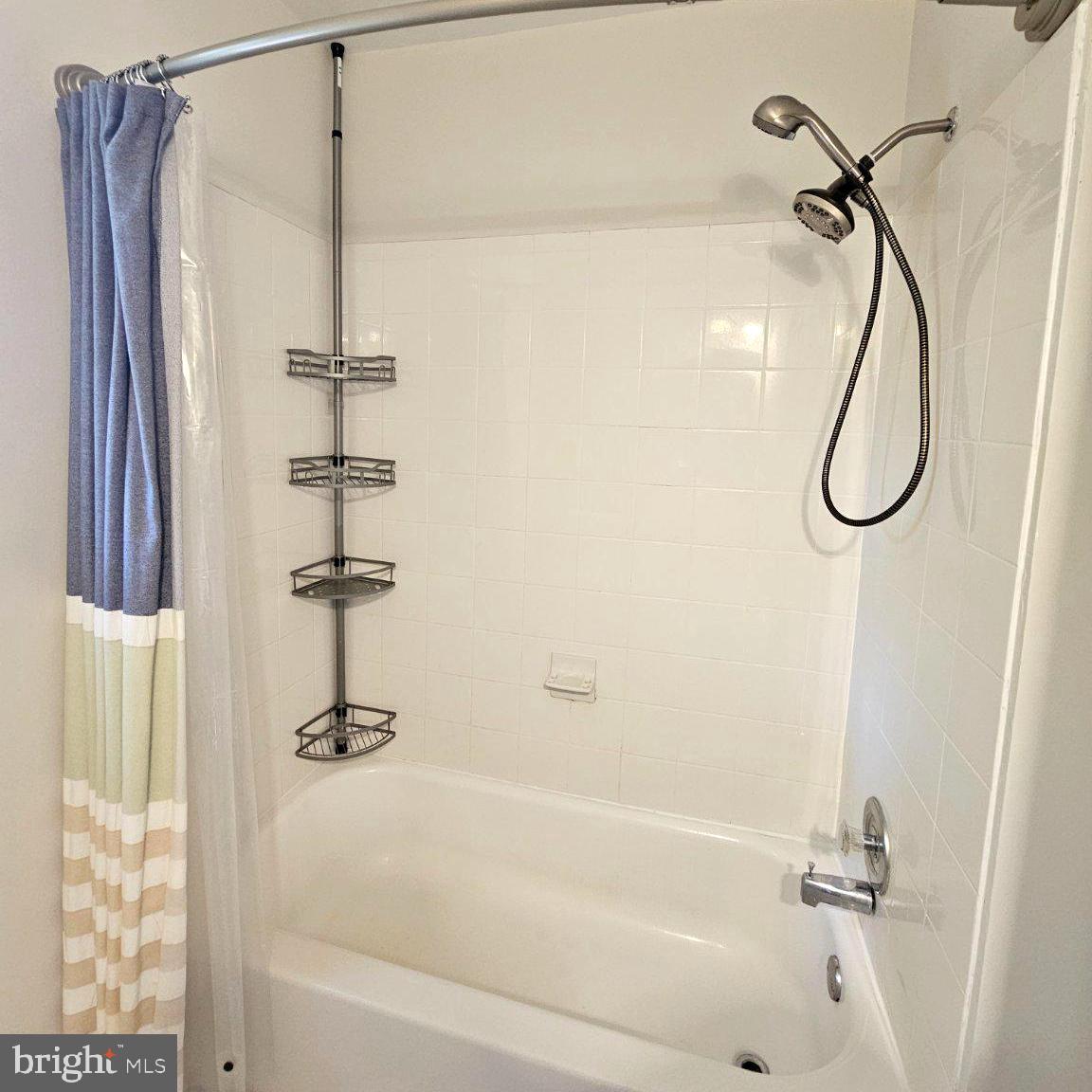 7433 Grace Street Springfield, VA 22150 - Photo 15 of 24 Modern shower with sleek design.