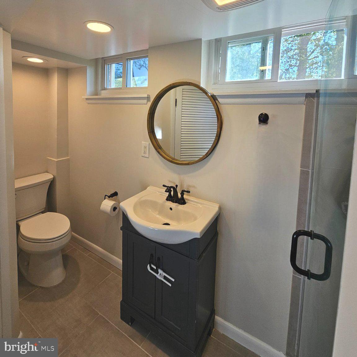 7433 Grace Street Springfield, VA 22150 - Photo 18 of 24 Modern bathroom with natural light.