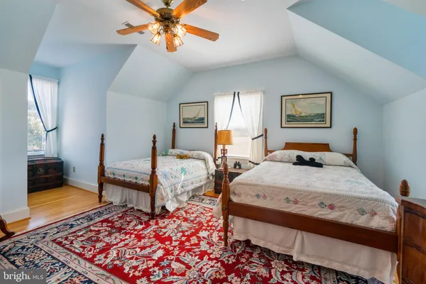 a bed room with a bed and window