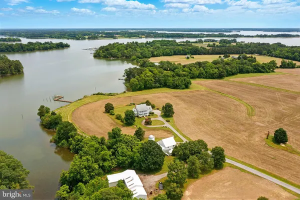 an aerial view of a house with a lake view