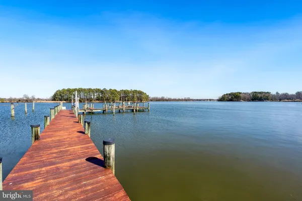 a view of a lake with a yard